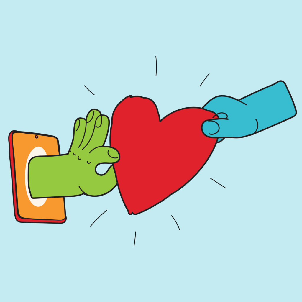 Two hands gripping a heart, one blue and one green. The green hand is coming out of the screen of a mobile phone.