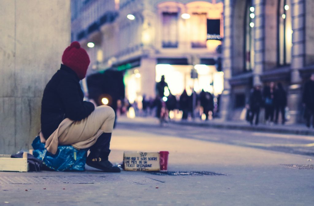 An image of a homeless young person living on the streets.