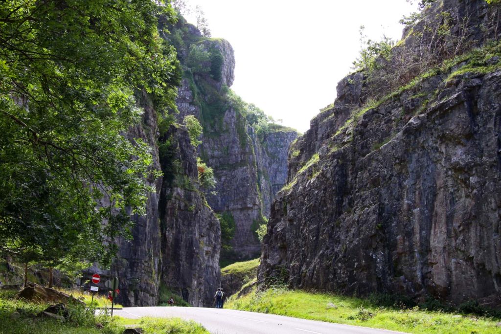 A photo of Cheddar Gorge, taken from the road at ground level, looking through the Gorge.