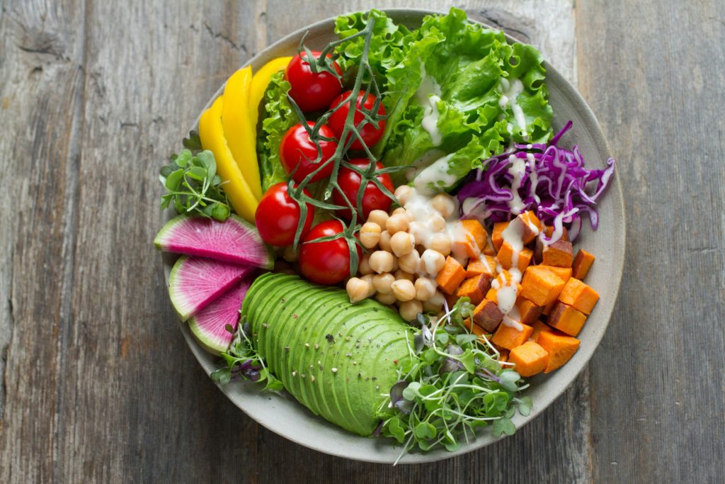 A photo of a bowl of fruit and vegetables