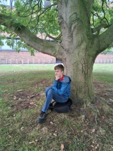 Somerset member of Youth Parliament Luca sat under a tree